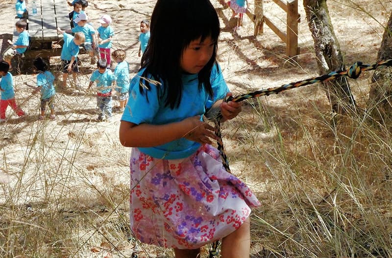 Child climbing rope