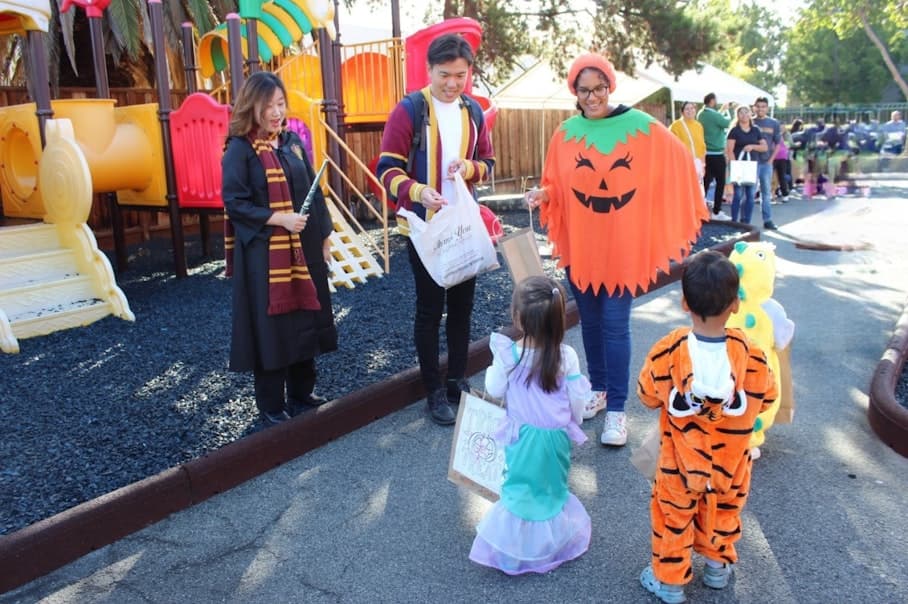 Students, teachers, and parents in costumes