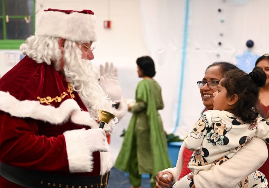 Santa talking to student